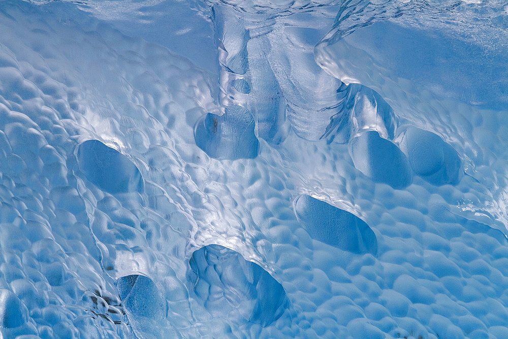 Glacial iceberg detail from ice calved off the Sawyer Glacier in Tracy Arm, Southeast Alaska, USA, Pacific Ocean.