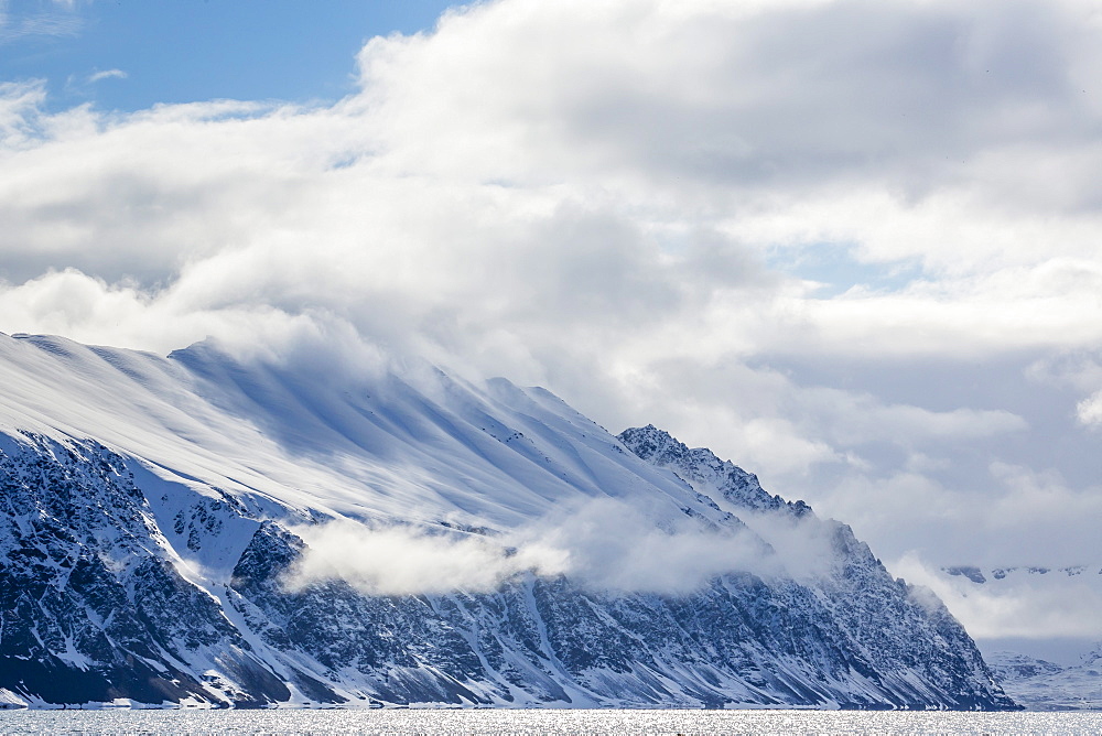 Dramatic skies in Signehamna, Krossfjorden, Spitsbergen, Svalbard, Norway, Scandinavia, Europe