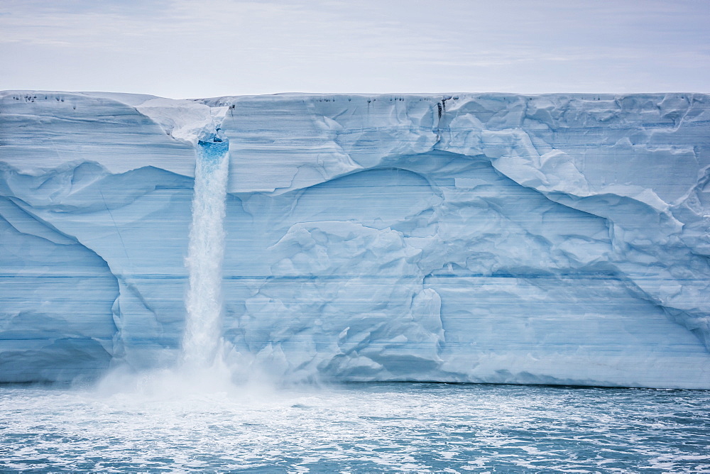 Melt water cascading off Austfonna, Nordaustlandet, Svalbard, Norway, Scandinavia, Europe