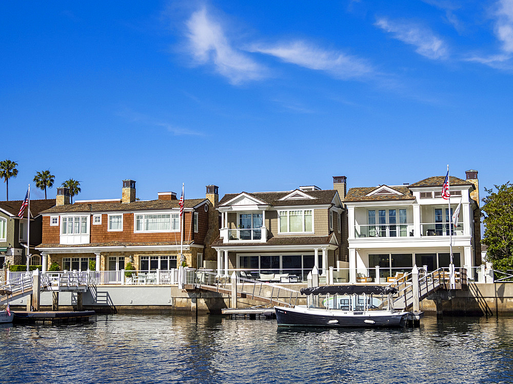 Multi million dollar homes long the water in the Newport Beach, California, USA.