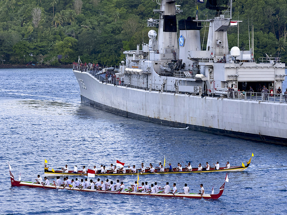 Groups of rowers coming out to greet our ship in the island of Banda Neira, Moluccas, Indonesia.