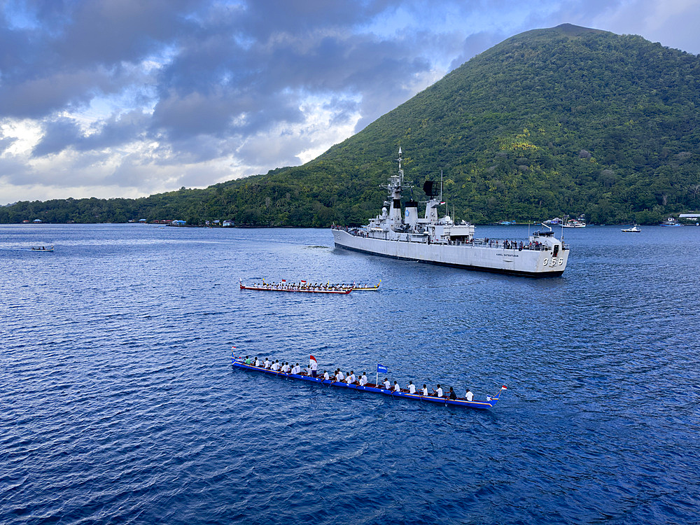 Groups of rowers coming out to greet our ship in the island of Banda Neira, Moluccas, Indonesia.