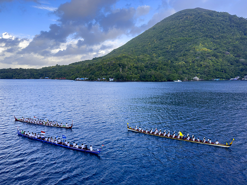 Groups of rowers coming out to greet our ship in the island of Banda Neira, Moluccas, Indonesia.
