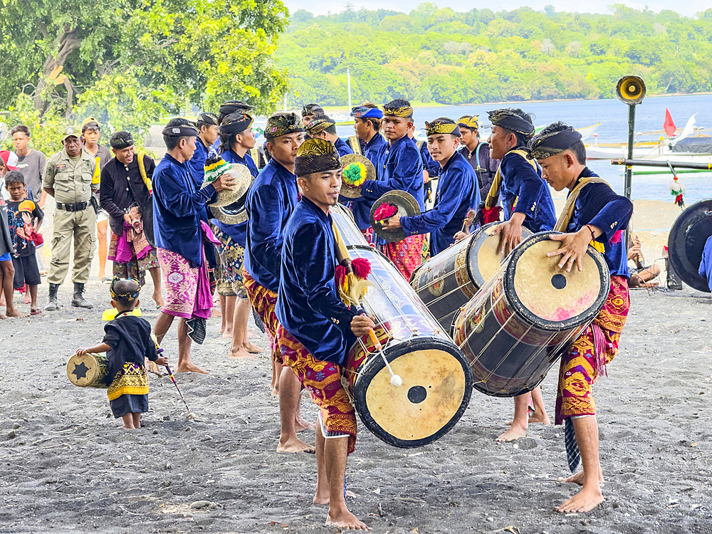 Ceremonial drummers coming to perform with their ornately painted drums on Sumbawa Island, Indonesia.
