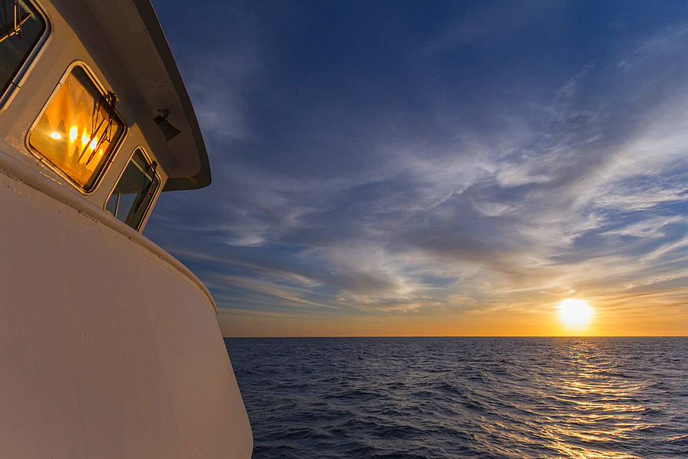 Sunrise off the bow near Danzante Island in the Gulf of California, Baja California Sur, Mexico.