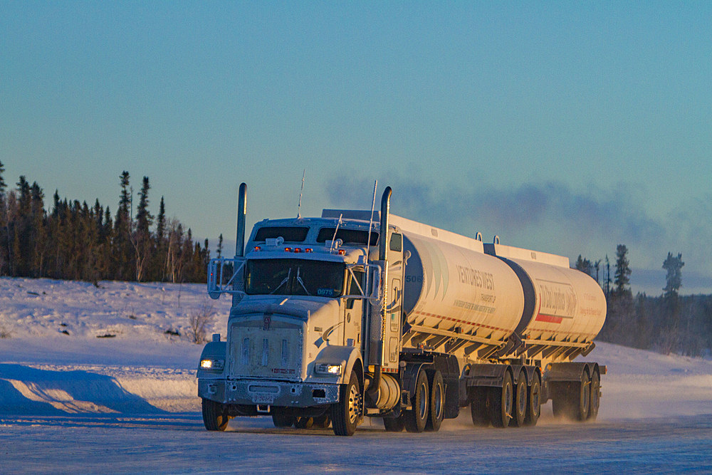 Heavy trucks on the ice road from Tibbitt to Contwoyto on the frozen Great Slave Lake, Northwest Territories, Canada.