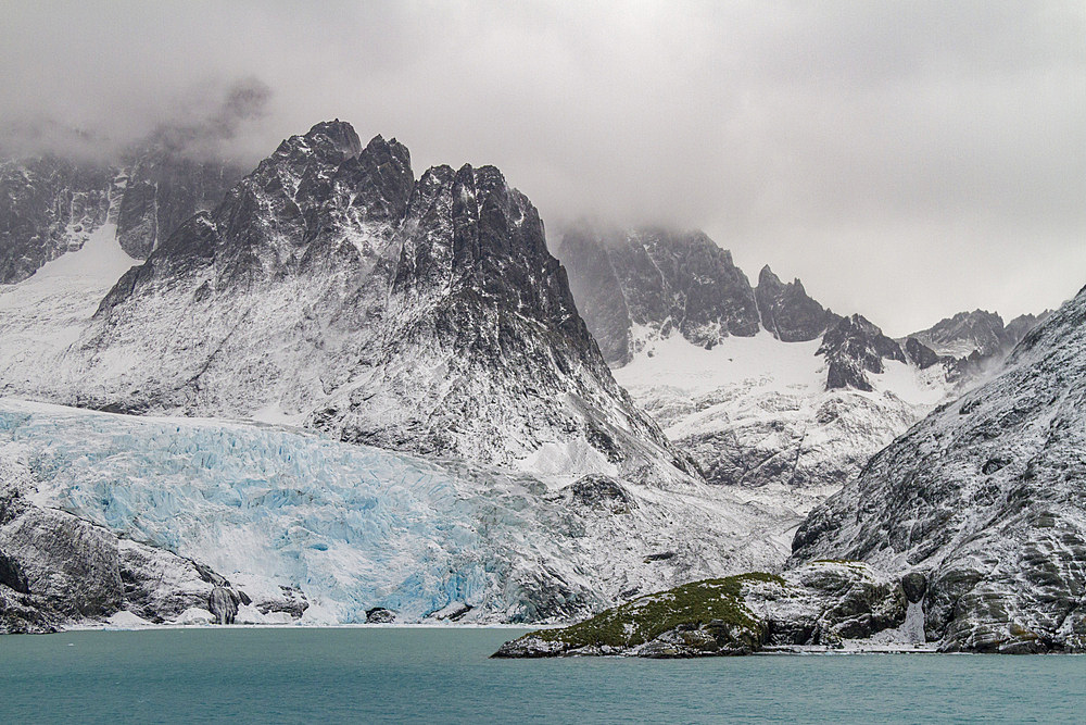 Views of Larsen Harbour in Drygalski Fjord during a snowstorm on South Georgia Island, Southern Ocean.