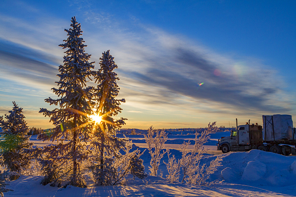 Heavy trucks on the ice road from Tibbitt to Contwoyto on the frozen Great Slave Lake, Northwest Territories, Canada.