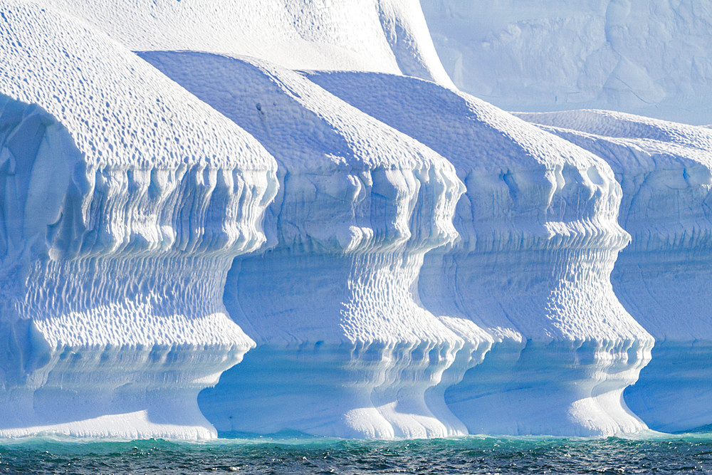 Iceberg detail showing the color blue around the Antarctic Peninsula, during the Austral summer months, Antarctica.
