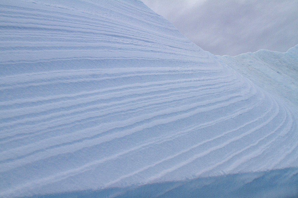 Iceberg detail showing the color blue around the Antarctic Peninsula, during the Austral summer months, Antarctica.