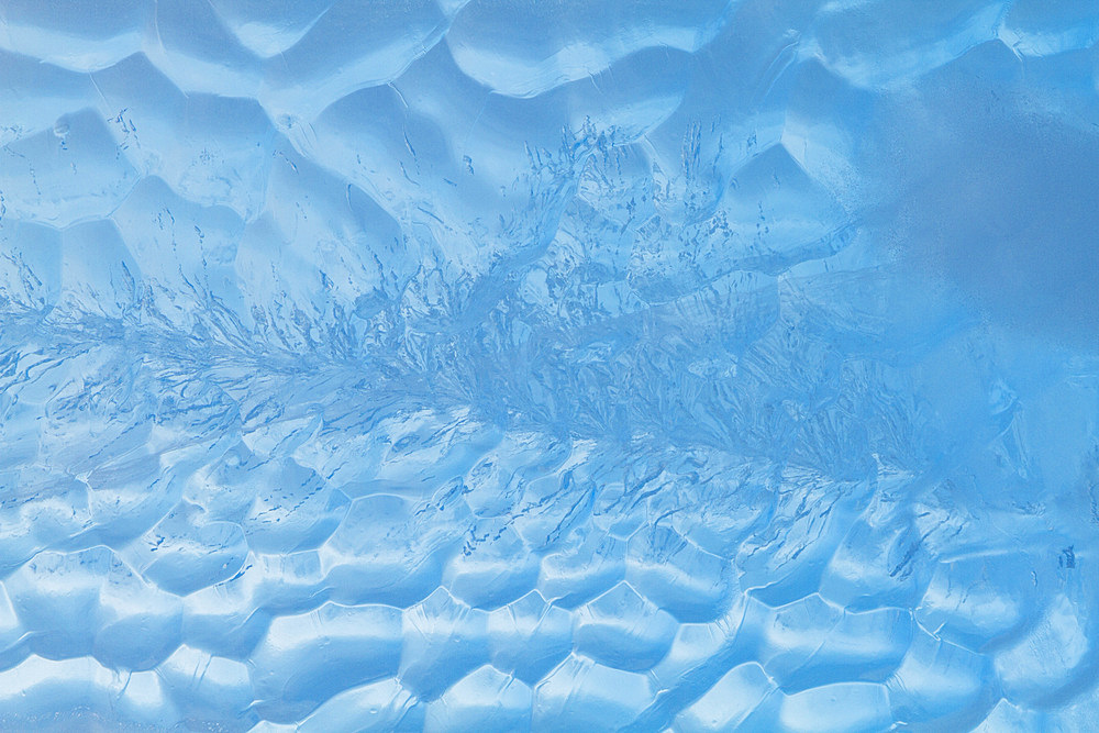 Iceberg detail showing the color blue around the Antarctic Peninsula, during the Austral summer months, Antarctica.