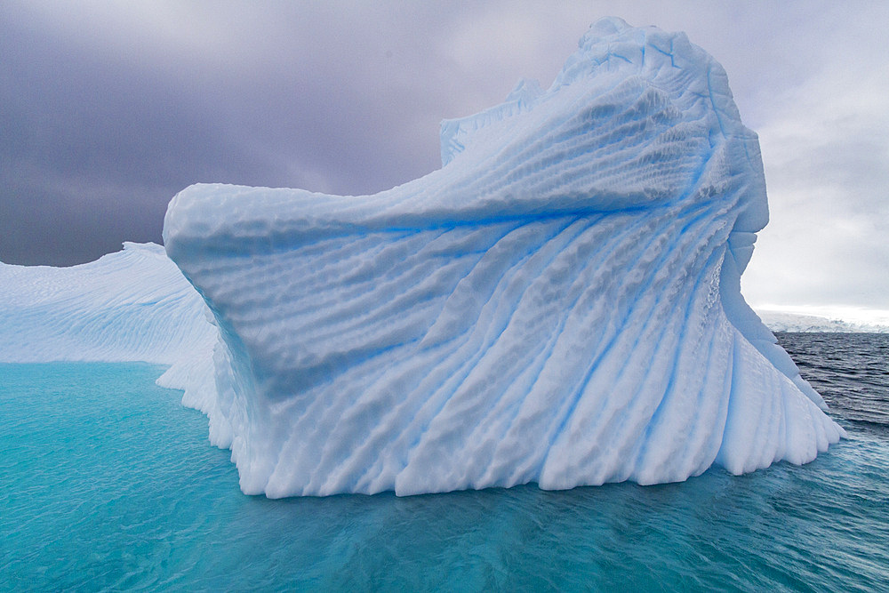 Iceberg detail showing the color blue around the Antarctic Peninsula, during the Austral summer months, Antarctica.