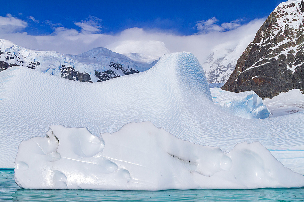 Iceberg detail showing the color blue around the Antarctic Peninsula, during the Austral summer months, Antarctica.