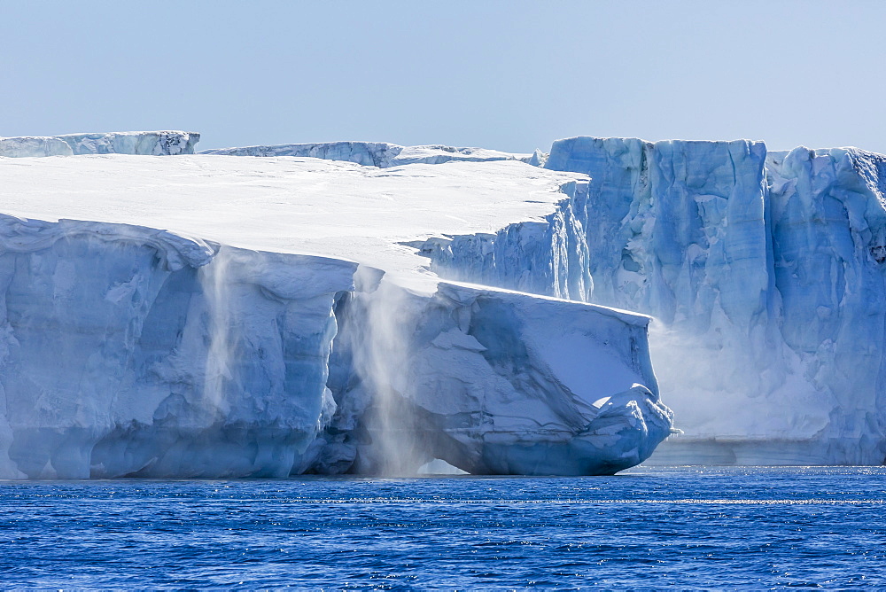 Katabatic winds blow snow into the sea off glacier face at Brown Bluff, Weddell Sea, Antarctica, Polar Regions