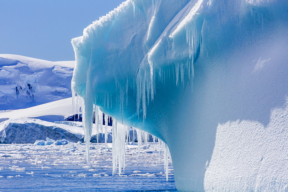 Icicles hang from a glacial iceberg at Cierva Cove, Antarctica, Polar Regions