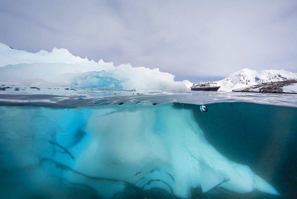 Above and below view of glacial ice near Wiencke Island, Neumayer Channel, Antarctica, Polar Regions