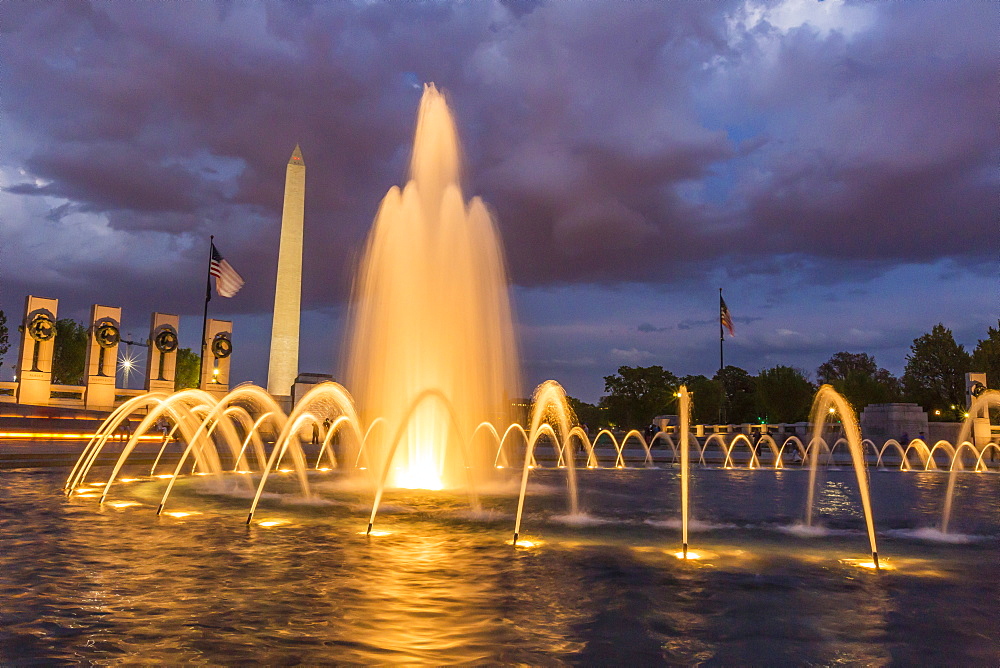 The Washington Monument lit up at night as seen from the World War II Monument, Washington D.C., United States of America, North America