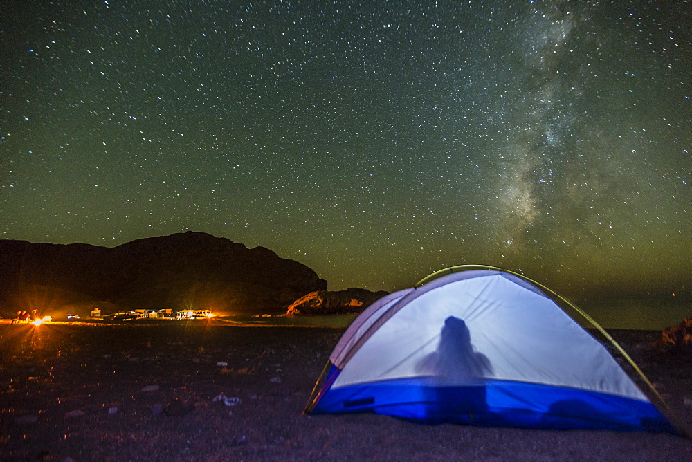 Night view of the Milky Way with lit up tent in foreground, Himalaya Beach, Sonora, Mexico, North America