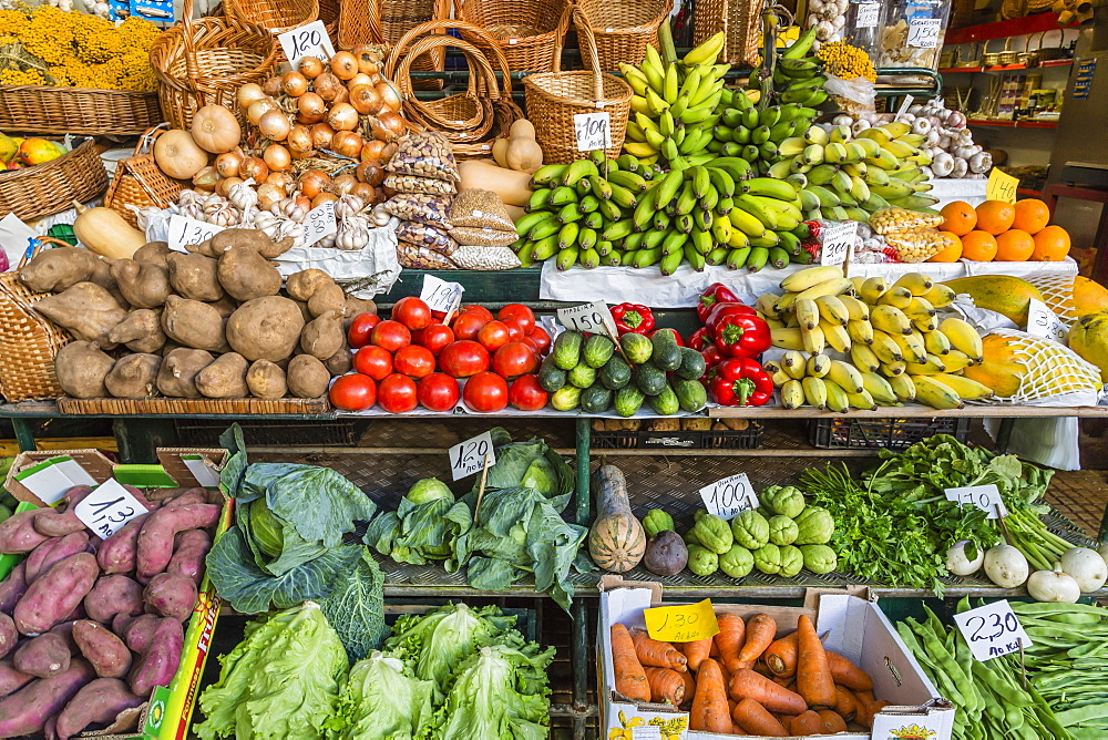 Vendors inside the Funchal Market, where fresh produce and fish are sold in the capital city of Funchal, Madeira, Portugal, Europe