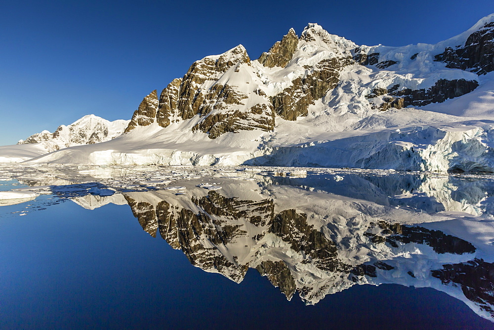 Reflections in the calm waters of the Lemaire Channel, Antarctica, Polar Regions