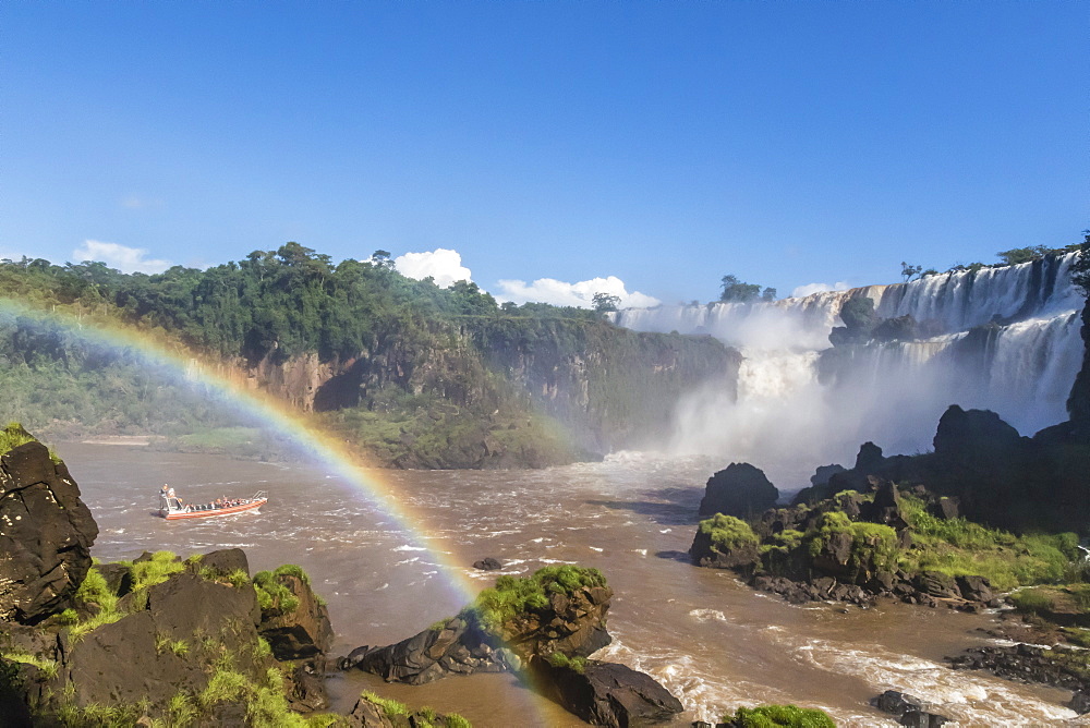 A river boat at the base of the falls, Iguazu Falls National Park, UNESCO World Heritage Site, Misiones, Argentina, South America