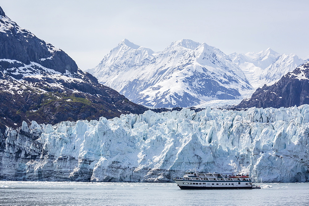 A tourist ship explores the Lamplugh Glacier in Glacier Bay National Park and Preserve, southeast Alaska, United States of America, North America