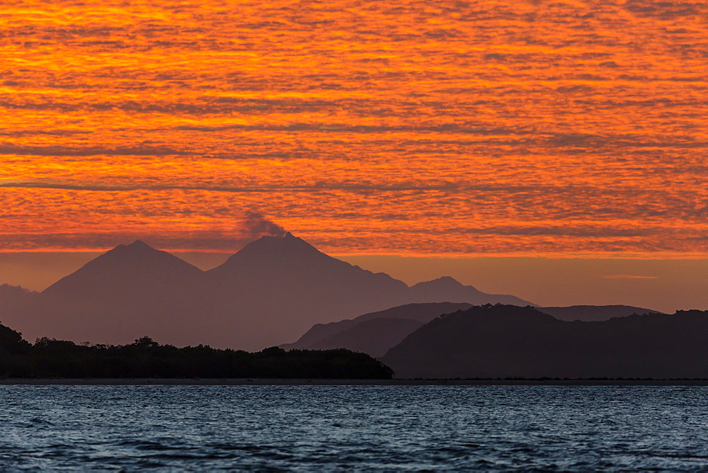 Sunset over Komodo National Park, Rinca Island, Flores Sea, Indonesia, Southeast Asia, Asia