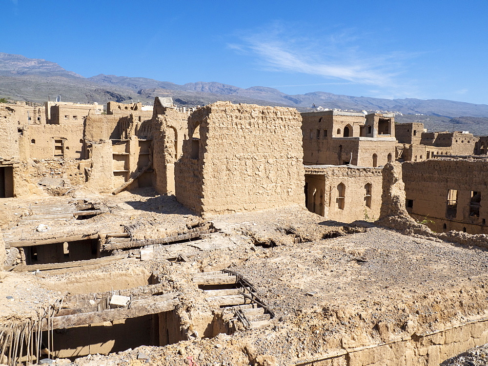 Exterior view of a mostly abandoned mud construction houses in Bait Al Safah, Al Hamra, Sultanate of Oman, Middle East