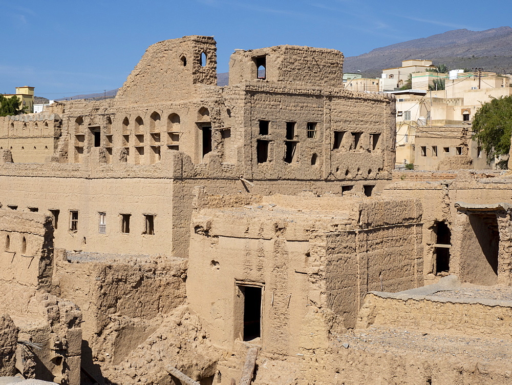 Exterior view of a mostly abandoned mud construction houses in Bait Al Safah, Al Hamra, Sultanate of Oman, Middle East