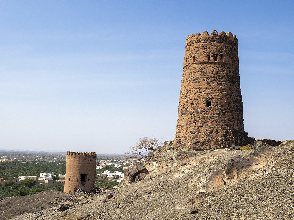 Remains of the mud and clay watch towers in the village of Mudayrib, Sultanate of Oman, Middle East