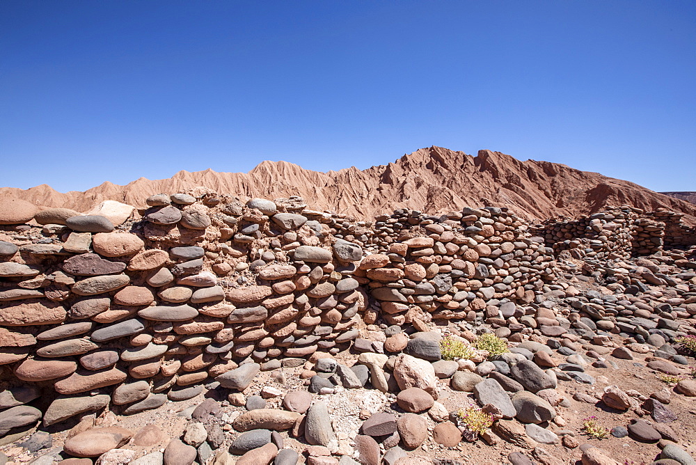 Remnants of rock structures in Tambo de Catarpe, Catarpe Valley in the Atacama Desert, Chile, South America