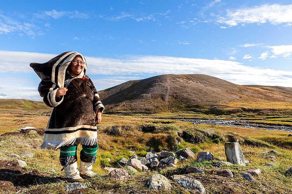 Inuit woman in traditional handmade clothing, Pond Inlet, Mittimatalik, in northern Baffin Island, Nunavut, Canada, North America