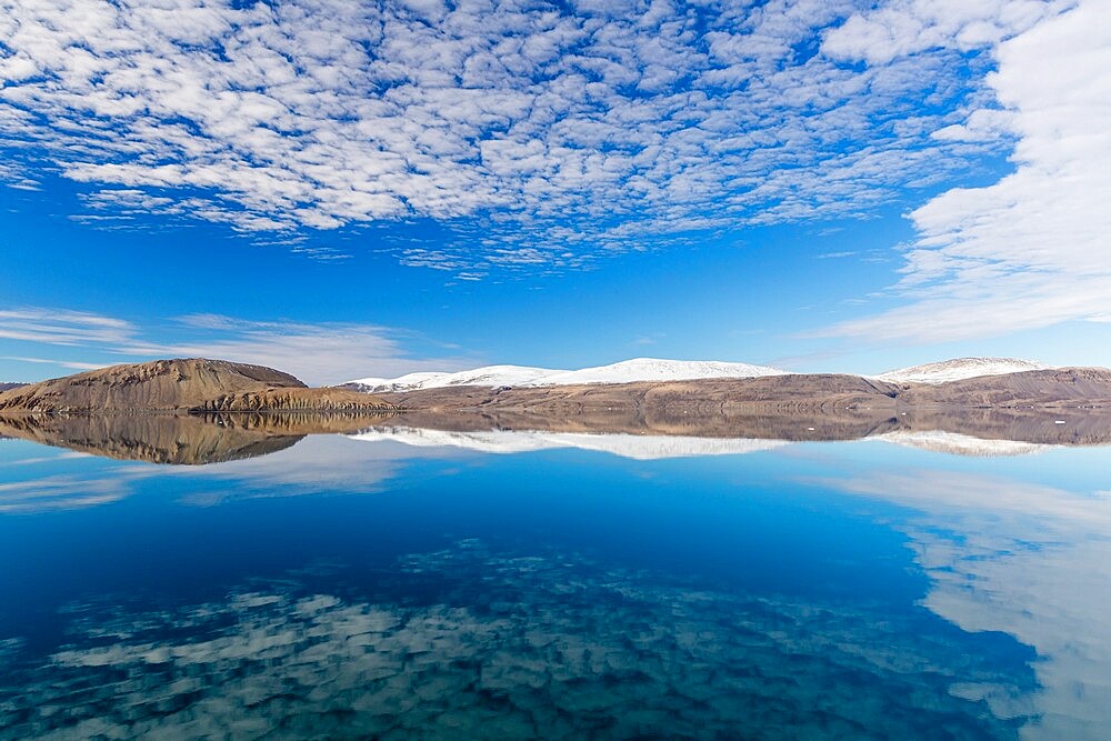 Reflections in the calm waters of Makinson Inlet, Ellesmere Island, Nunavut, Canada, North America