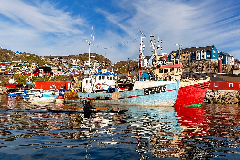 Local paddler demonstrates kayak techniques in the Greenlandic town of Qaqortoq, Greenland, Polar Regions