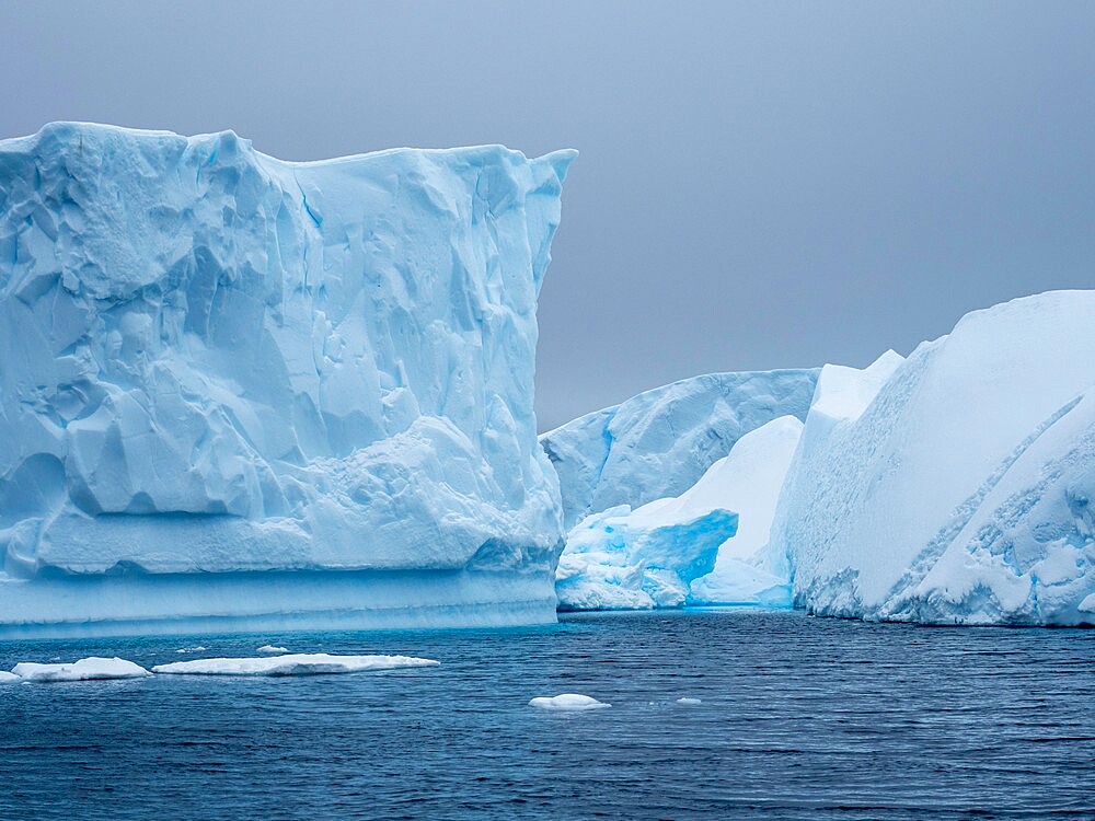 A huge iceberg grounded on a reef near the Iceberg Graveyard, Petermann Island, Antarctica, Polar Regions