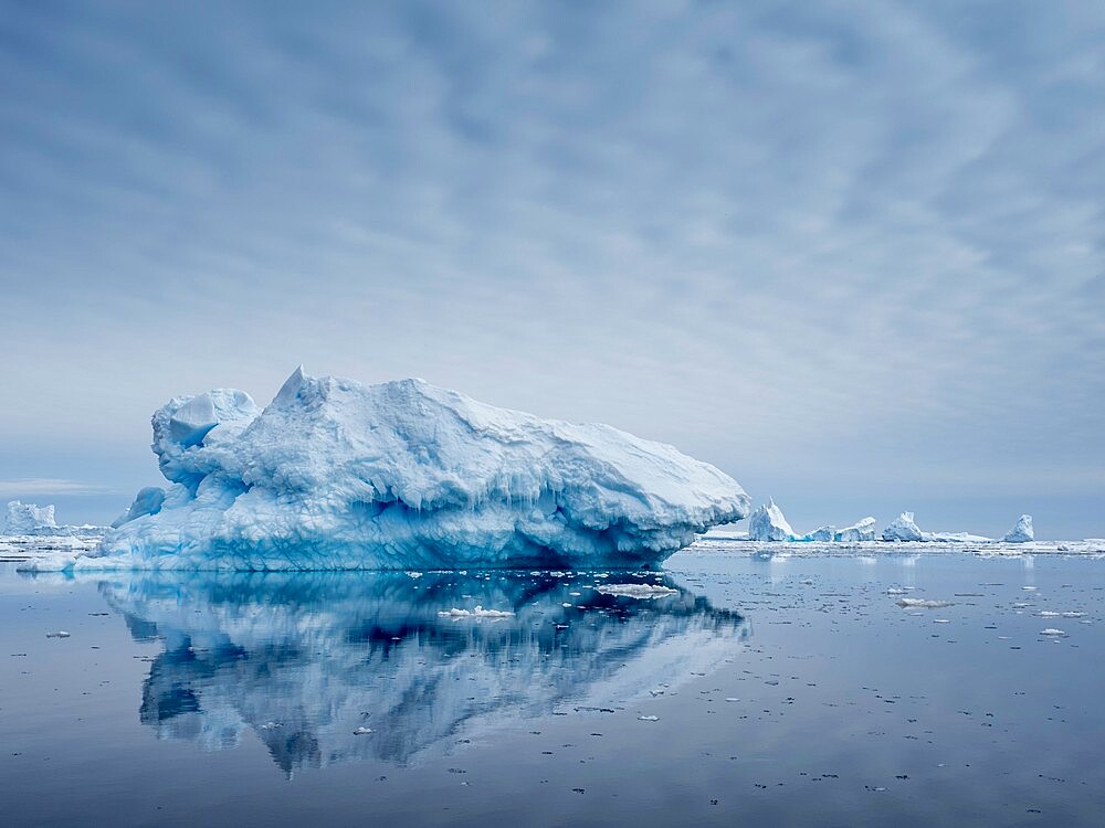 Large iceberg grounded on a reef at Peter I Island, Bellingshausen Sea, Antarctica, Polar Regions