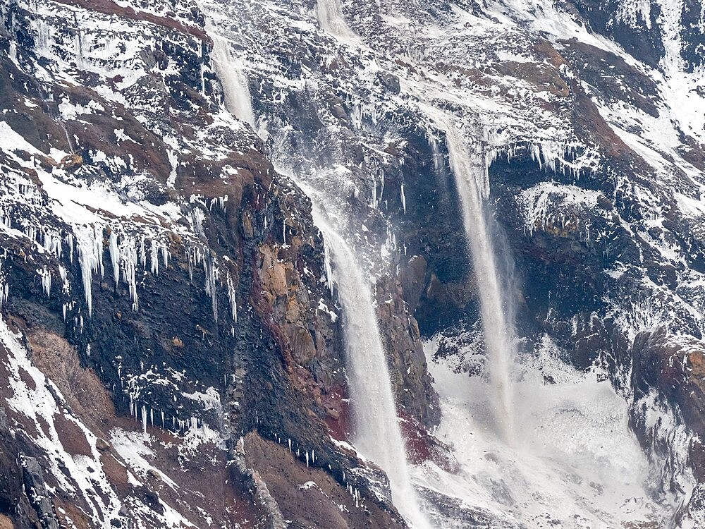 An avalanche of falling ice on Thule Island, a volcanic island in the South Sandwich Islands, South Atlantic, Polar Regions