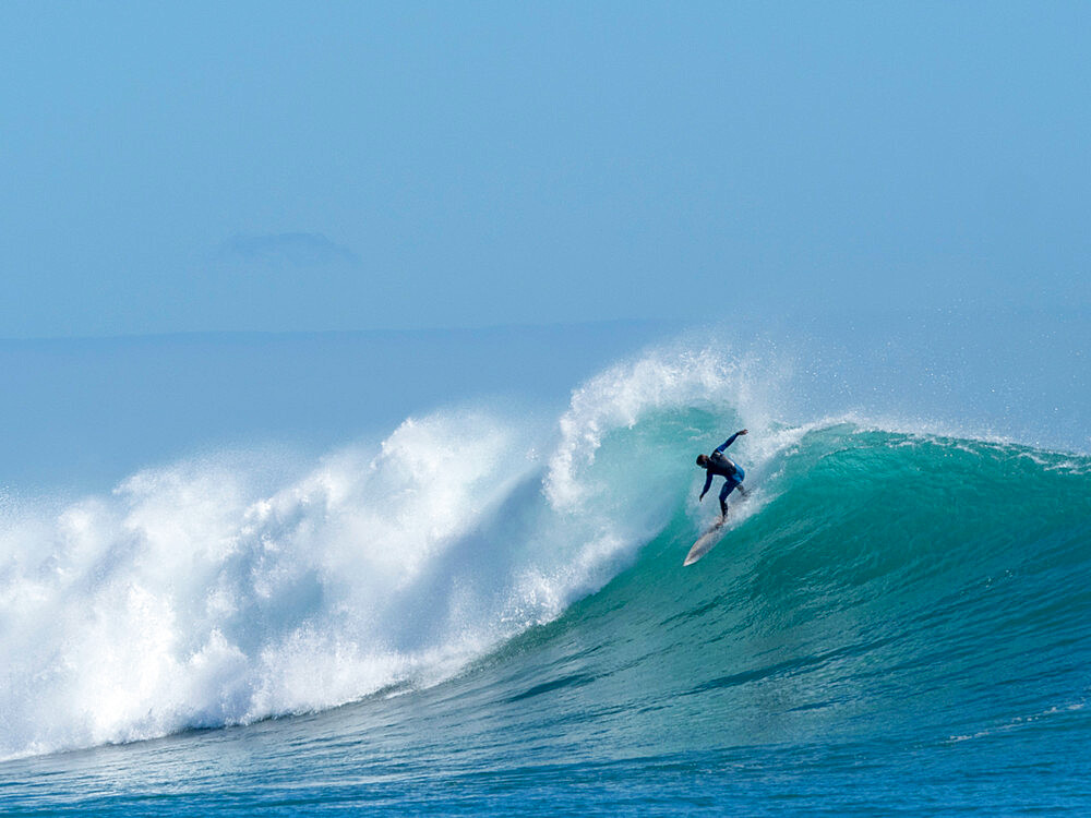 Surfer at North Reef, Lighthouse Bay, Exmouth, Western Australia, Australia, Pacific