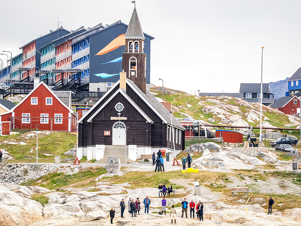 A view of Zion's Church surrounded by colorfully painted houses in the city of Ilulissat, Greenland, Denmark, Polar Regions