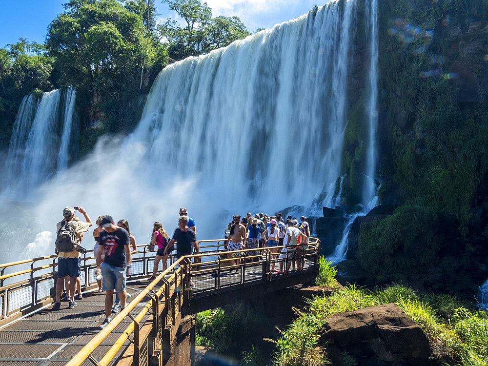 Tourists on a platform on the lower circuit at Iguazú Falls, Misiones Province, Argentina.