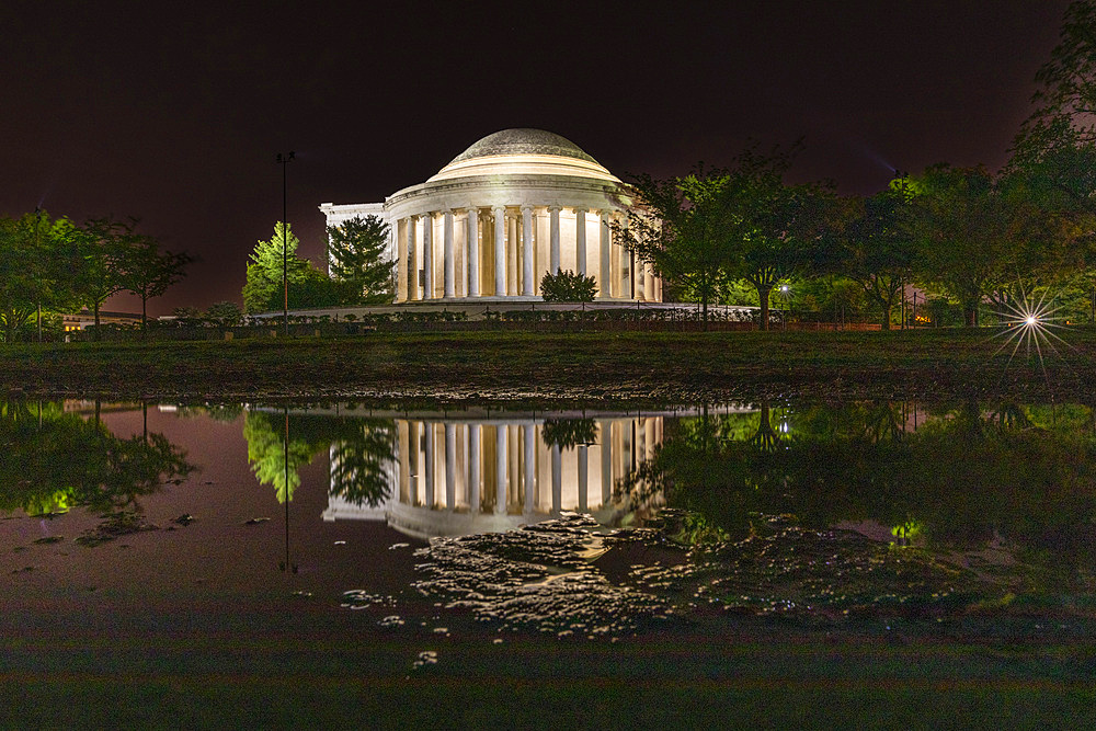 A night view of the Thomas Jefferson Memorial, lit up at night in West Potomac Park, Washington, D.C.