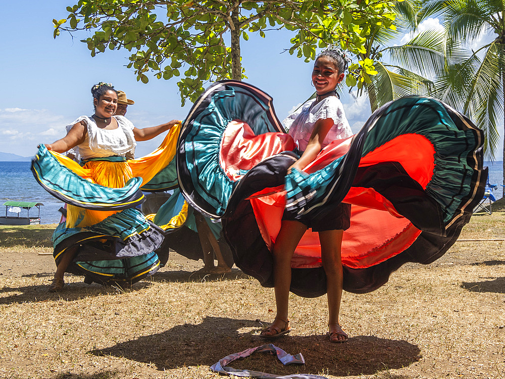 A group of young Costa Rican dancers in traditional dress perform at Playa Blanca, El Golfito, Costa Rica, Central America