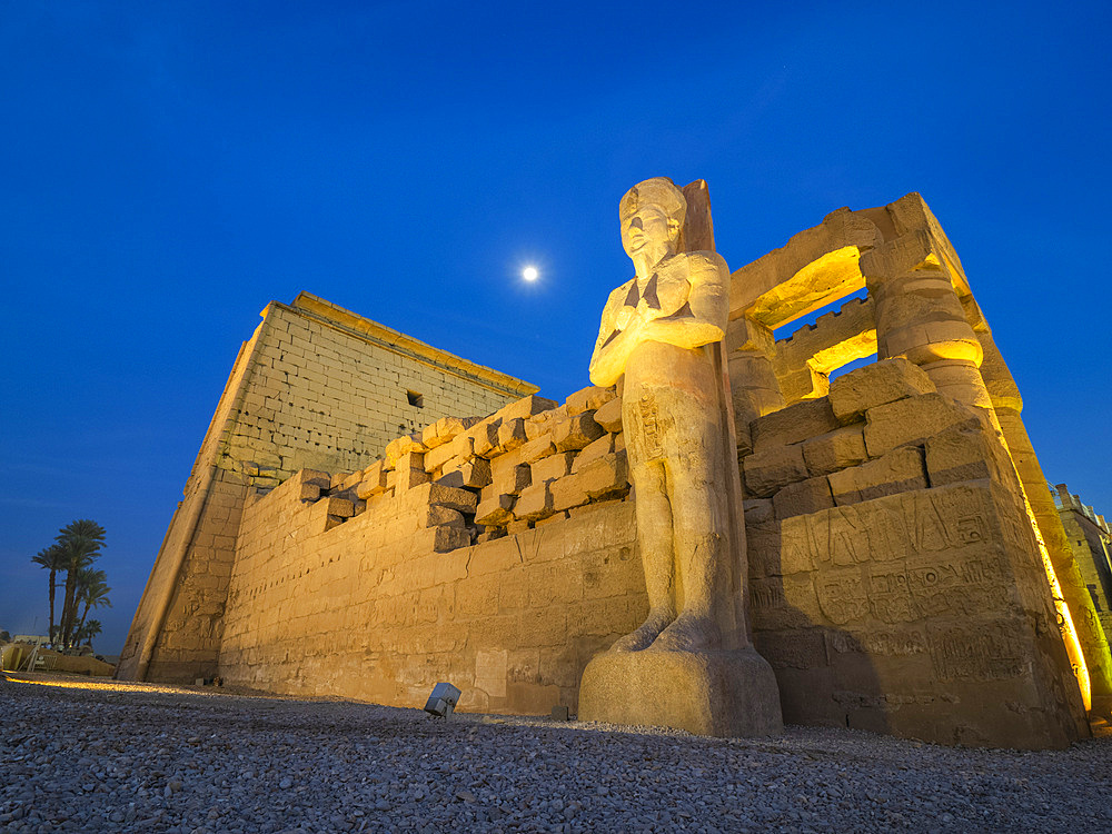 The Luxor Temple at night, under a full moon, constructed approximately 1400 BCE, UNESCO World Heritage Site, Luxor, Thebes, Egypt, North Africa, Africa