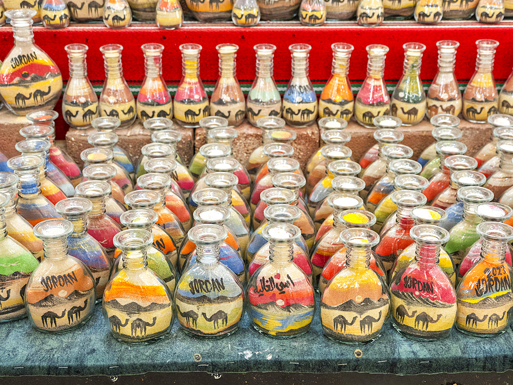 Colourful souvenir bottles of sand for sale in the city of Jerash, Jordan, Middle East