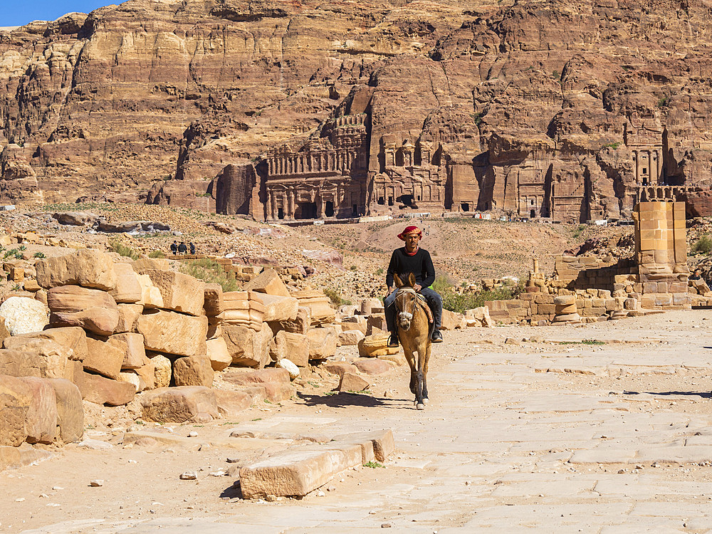 Donkey and rider, Petra Archaeological Park, UNESCO World Heritage Site, one of the New Seven Wonders of the World, Petra, Jordan, Middle East