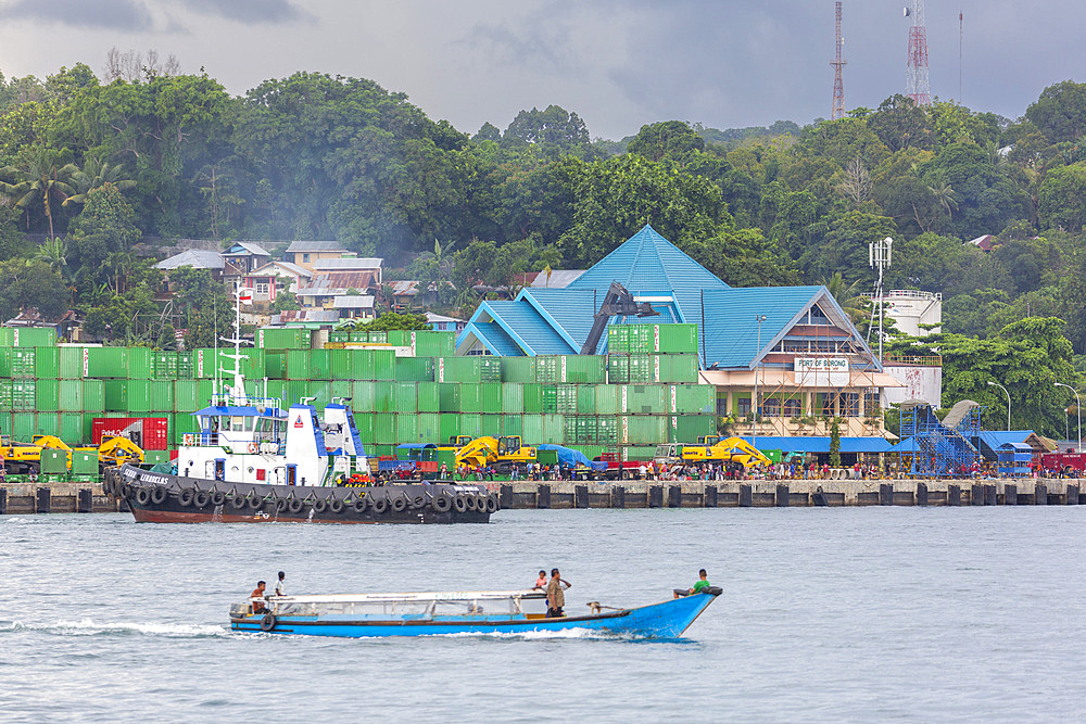 Boat and containers in the harbor in the city of Sorong, the largest city and the capital of the Indonesian province of Southwest Papua, Indonesia, Southeast Asia, Asia