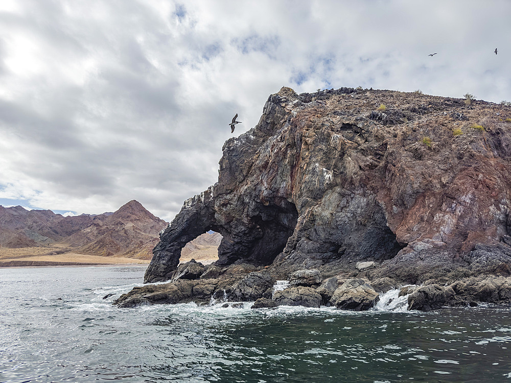 Natural arch in Puerto Refugio on the northern end of Angel de la Guarda Island, Baja California, Sea of Cortez, Mexico, North America