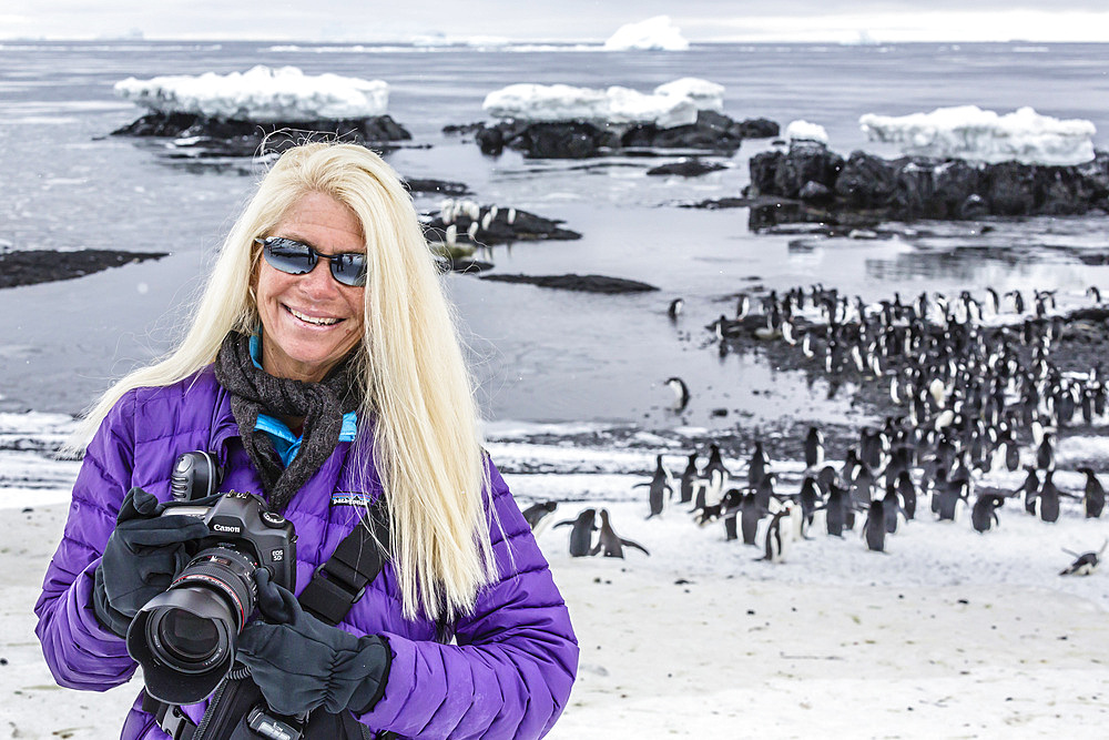 Staff from the Lindblad Expedition ship National Geographic Explorer (shown here is Photo Instructor CT Ticknor) working in Antarctica.