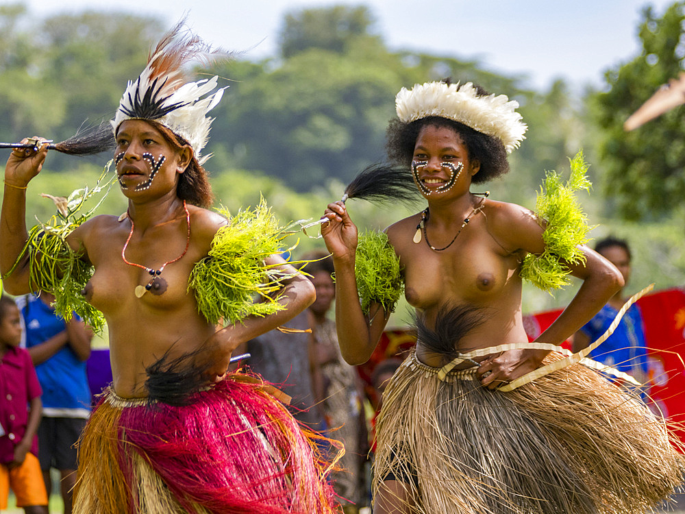 Six different groups of native warriors, drummers, and dancers perform on Kwato Island, Papua New Guinea, Pacific