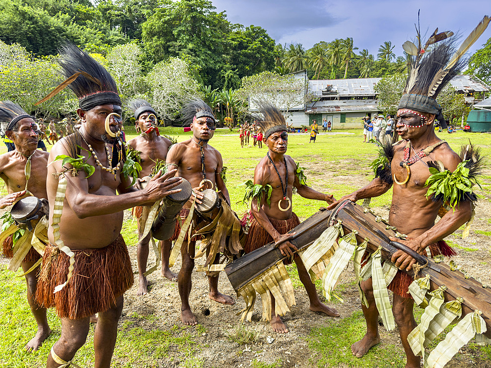 Six different groups of native warriors, drummers, and dancers perform on Kwato Island, Papua New Guinea, Pacific